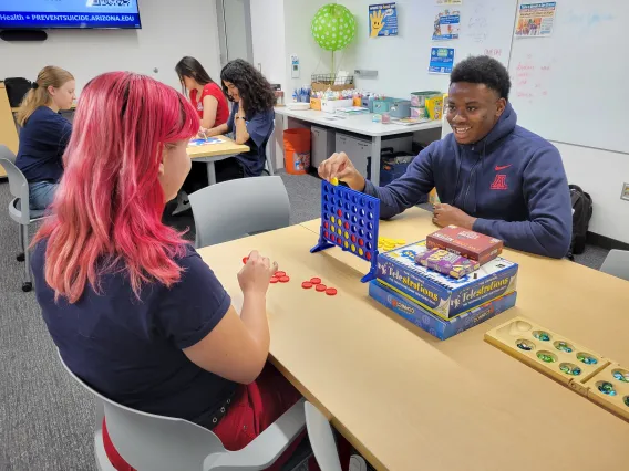 Two students playing connect 4