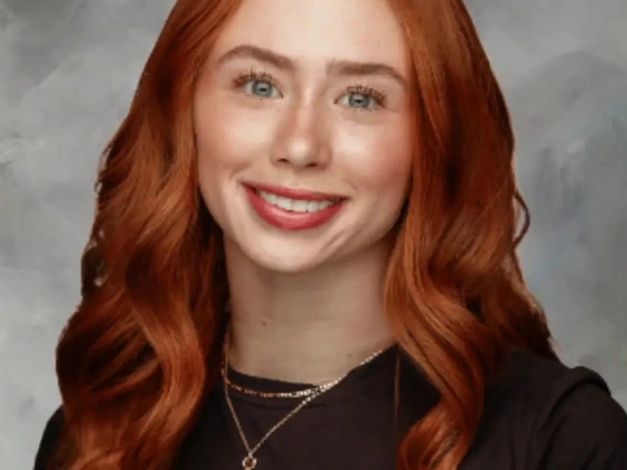 Person with red hair headshot 