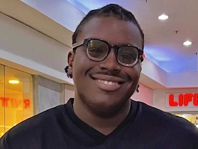 Person with glasses smiling 