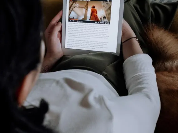 Person looking down at a tablet