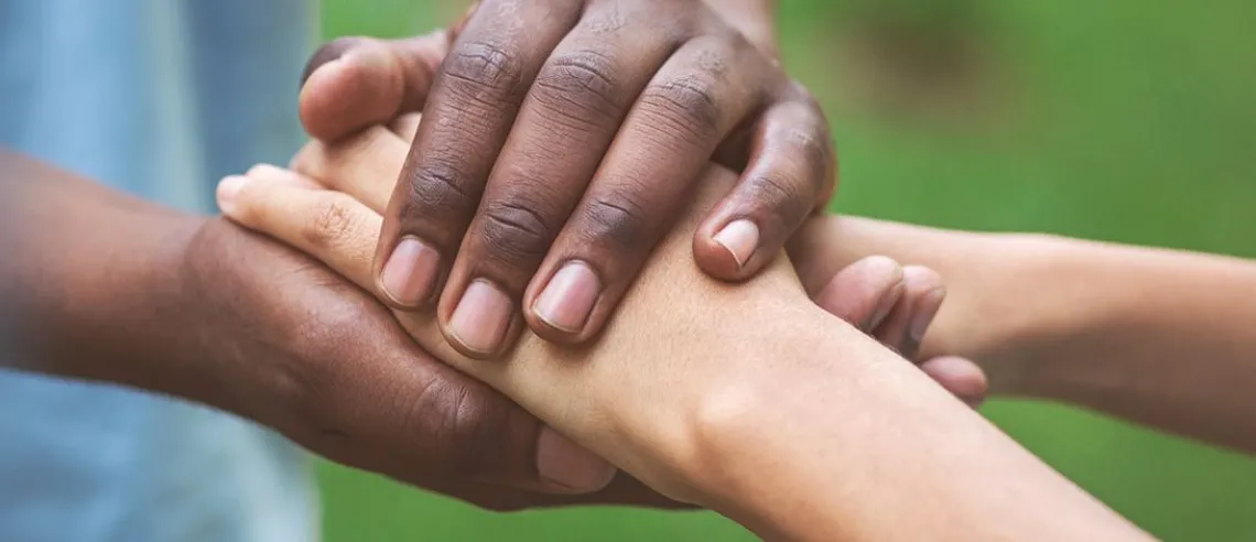 Close up of two people's hands holding eachother