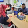 Two students playing connect 4